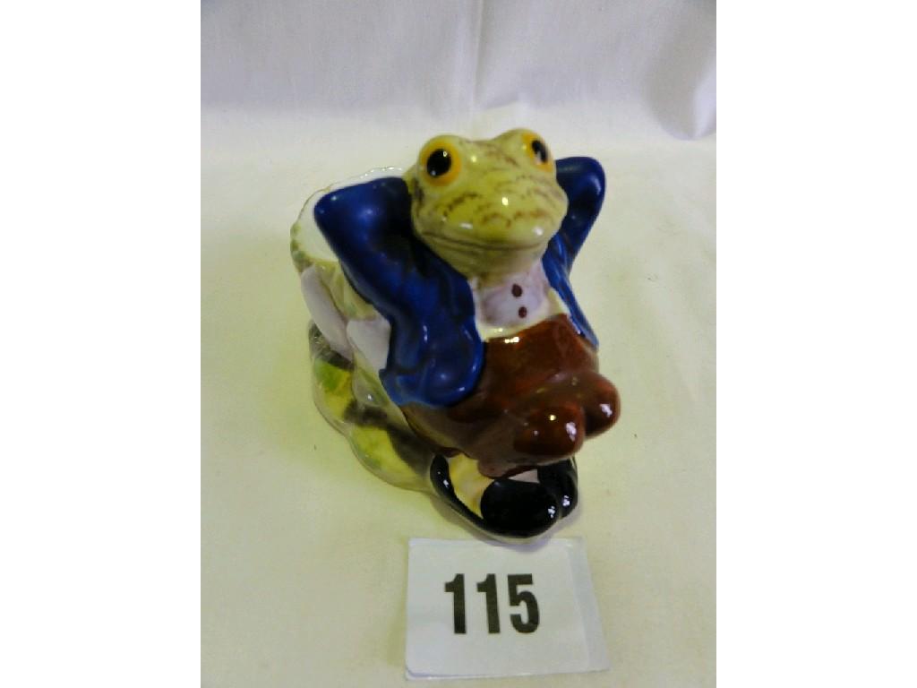 Appraisal: A vase in the form of a frog reclining against