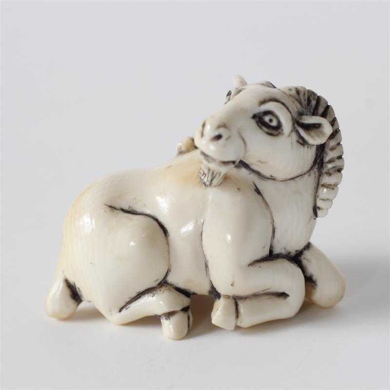 Appraisal: Japanese carved ivory netsuke ram signed H x W