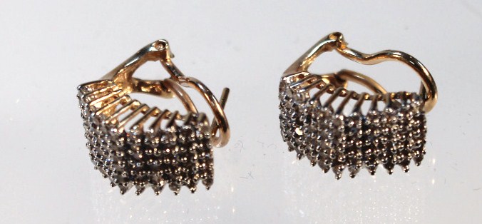 Appraisal: A pair of diamond cluster angular half hoop earrings with