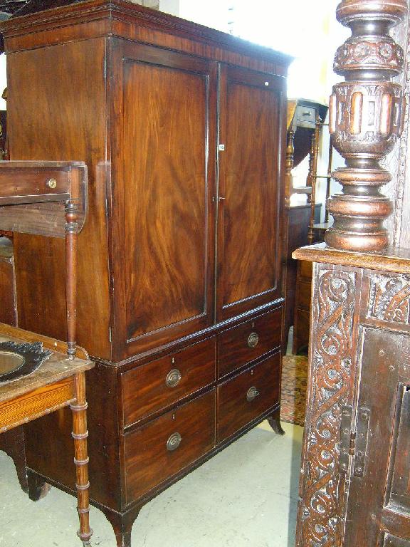 Appraisal: An early th century mahogany linen press the lower section