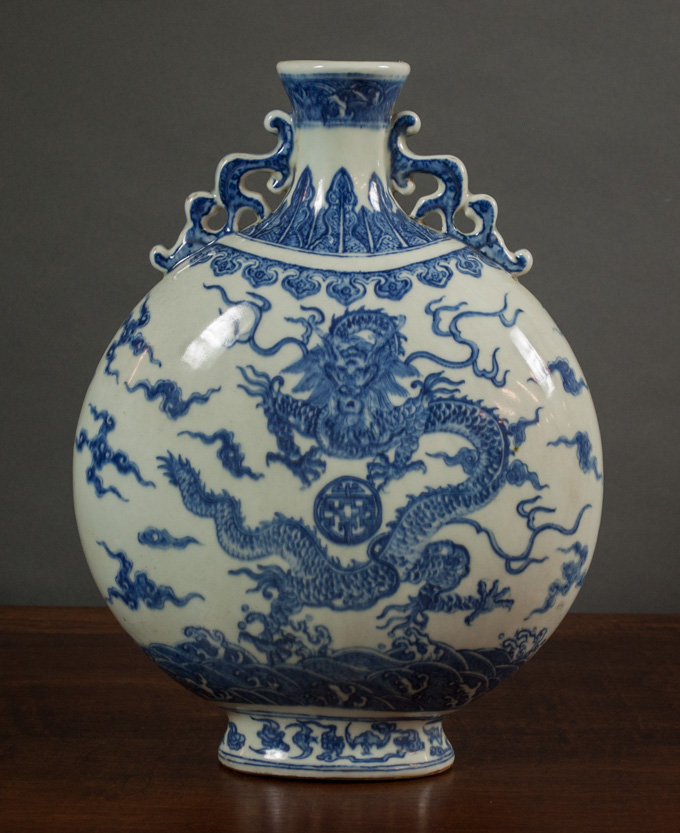 Appraisal: CHINESE QING BLUE AND WHITE PORCELAIN MOON FLASK with footed