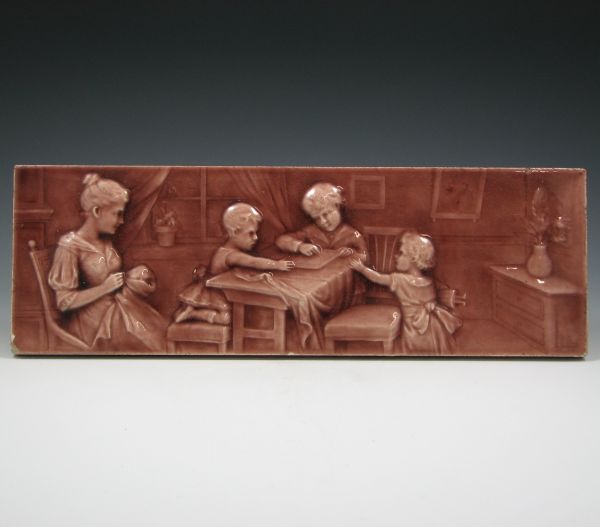 Appraisal: AET tile featuring a woman and three children in brown