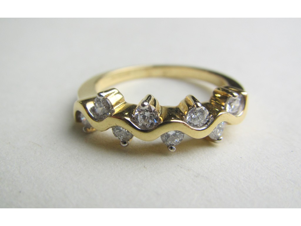 Appraisal: Eighteen carat yellow gold eight stone diamond set dress ring