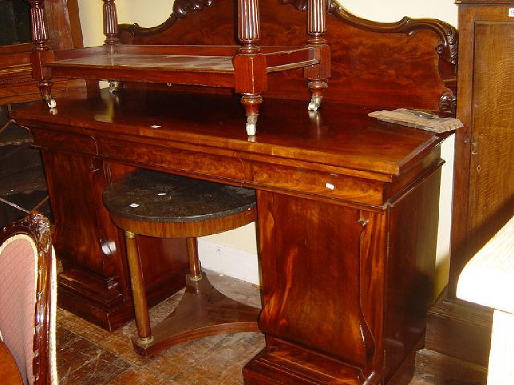 Appraisal: A Victorian mahogany pedestal sideboard the raised back with carved