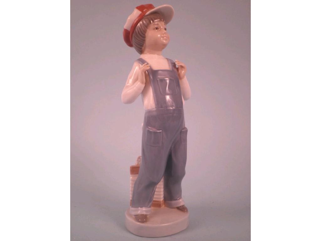 Appraisal: A Lladro porcelain figure of a young man wearing a