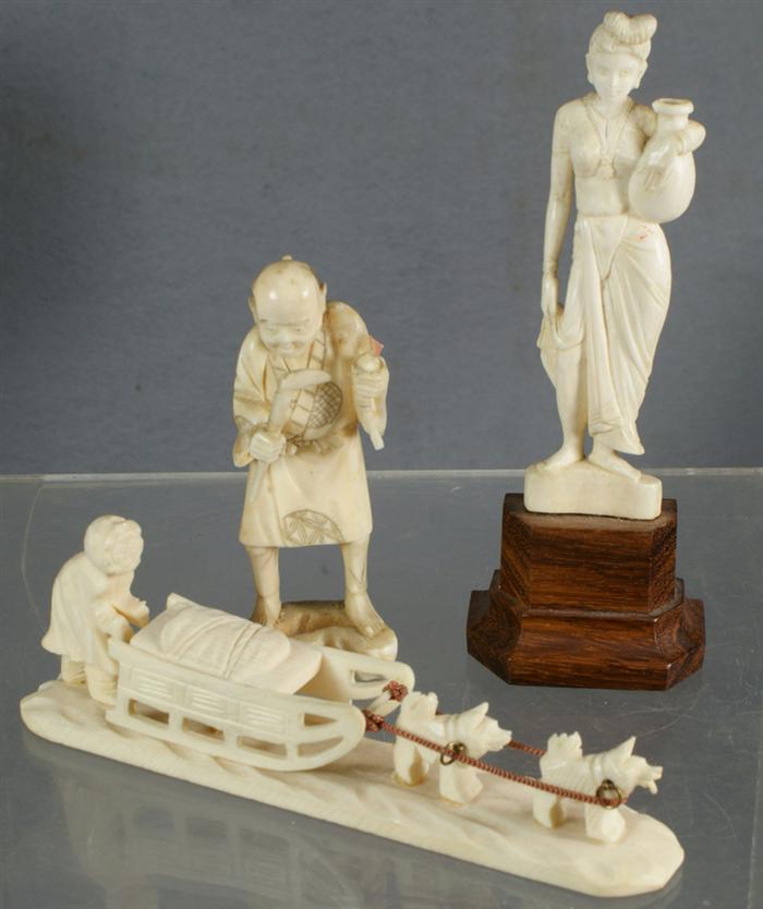 Appraisal: bone or ivory carving dog sled European woman Japanese man