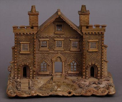 Appraisal: ENLGISH POTTERY MODEL OF A HOUSE FACADE AND GARDEN The