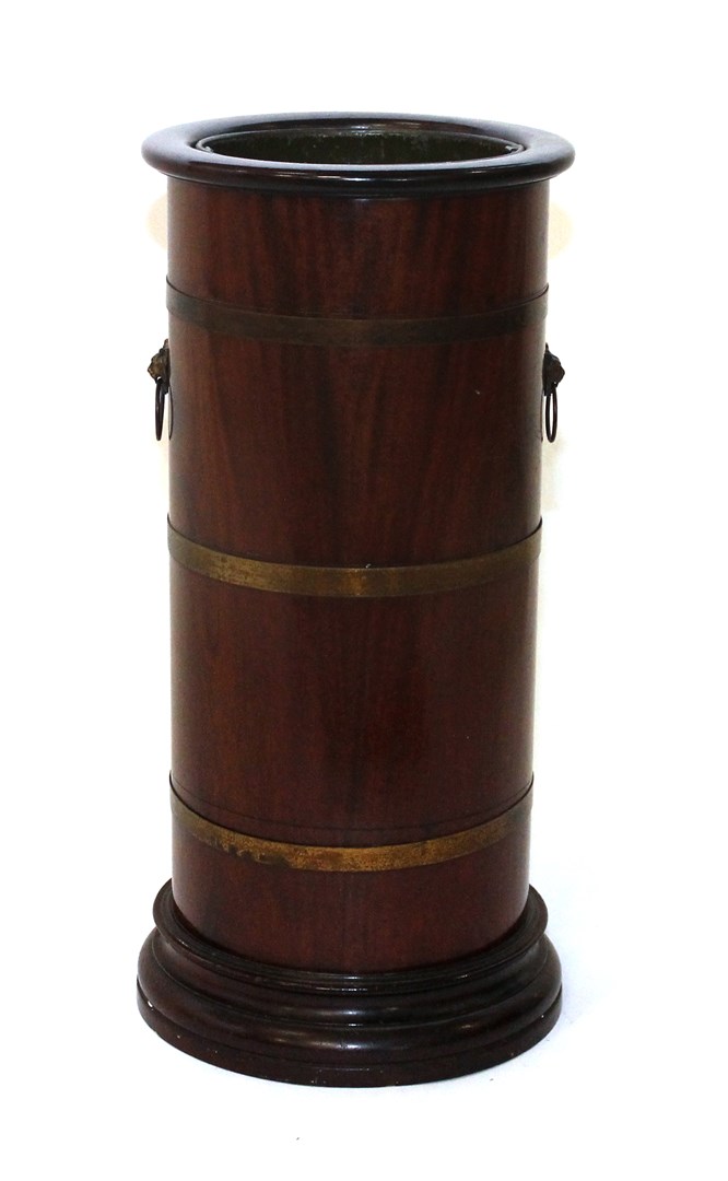 Appraisal: A th century brass bound mahogany cylindrical stick stand on