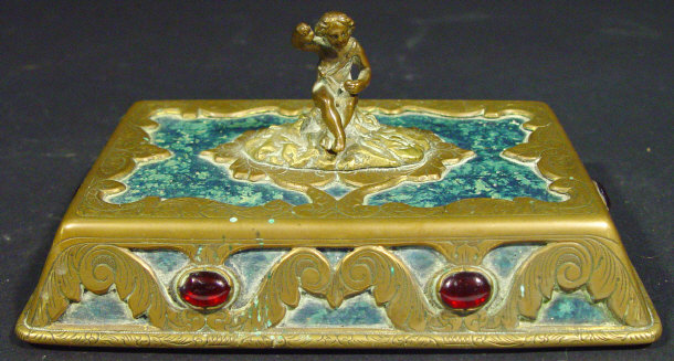 Appraisal: Victorian brass desk weight surmounted with a cherub the base