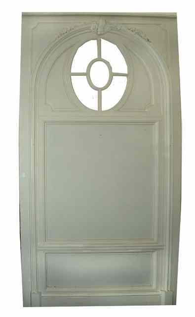 Appraisal: A LARGE PAINTED PINE AND CARVED WALL PANEL the arched