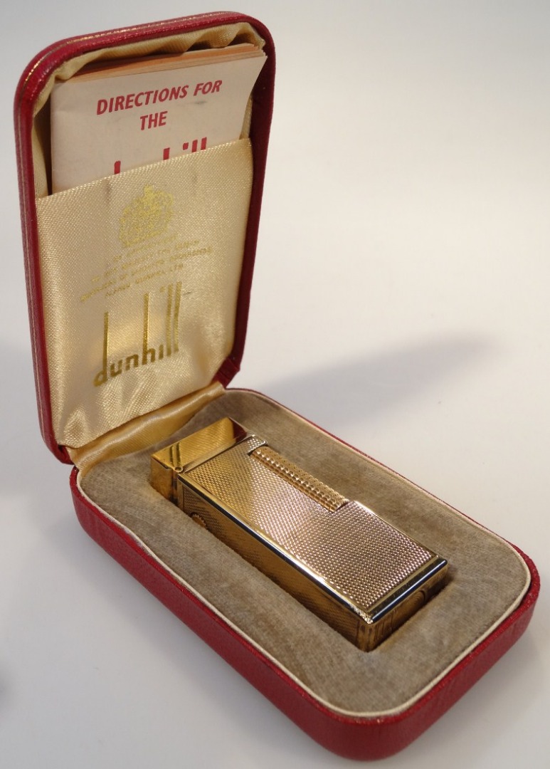 Appraisal: A mid- thC Dunhill pocket lighter in part engine turned