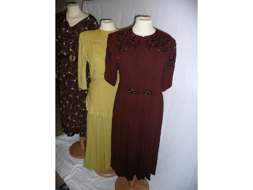 Appraisal: A vintage wool dress in mustard sleeve pleating detail on