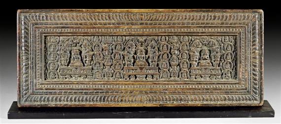 Appraisal: A WELL CARVED WOODEN SUTRA COVER SHOWING PRAJNAPARAMITA VAIROCANA AND