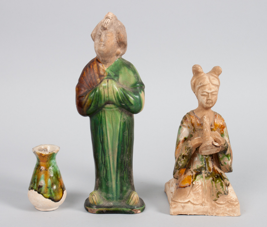 Appraisal: Two Chinese glazed terracotta tomb effigies modeled as standing courtesan