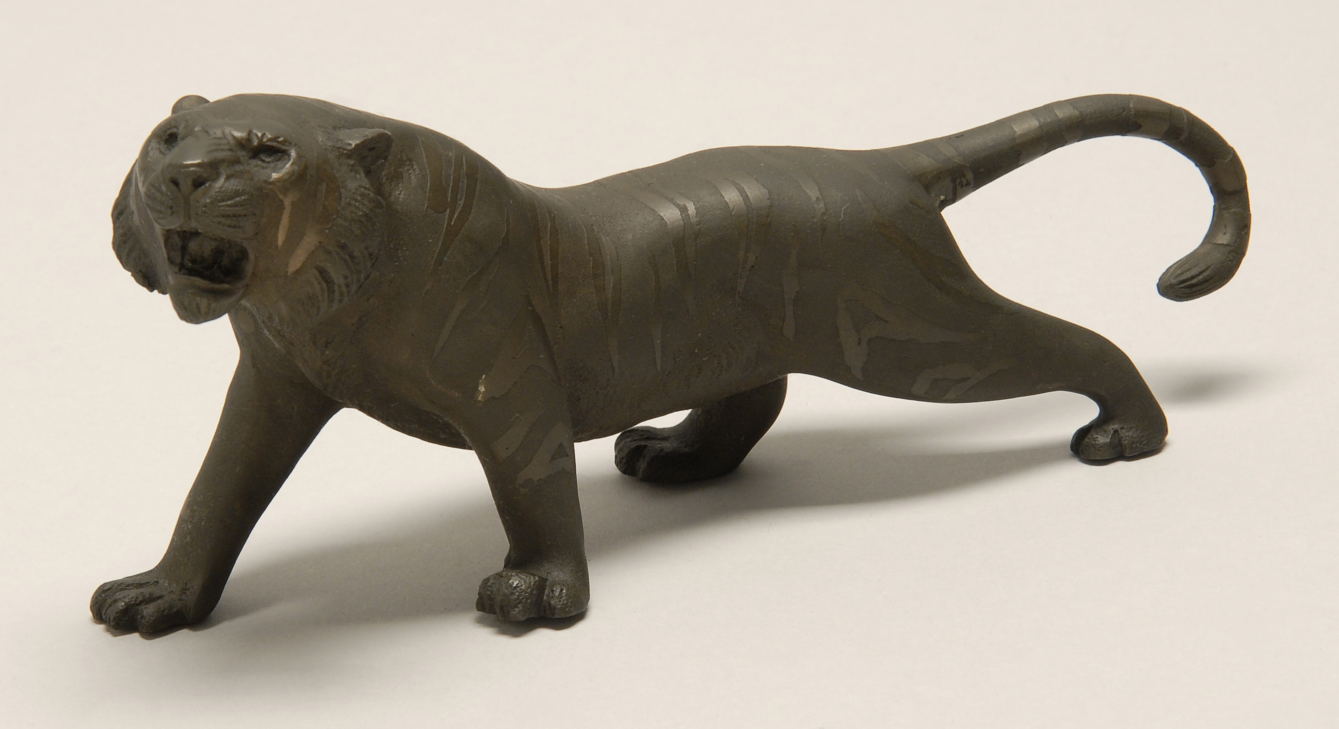 Appraisal: BRONZE FIGURE OF A TIGER Meiji PeriodStanding in a fierce