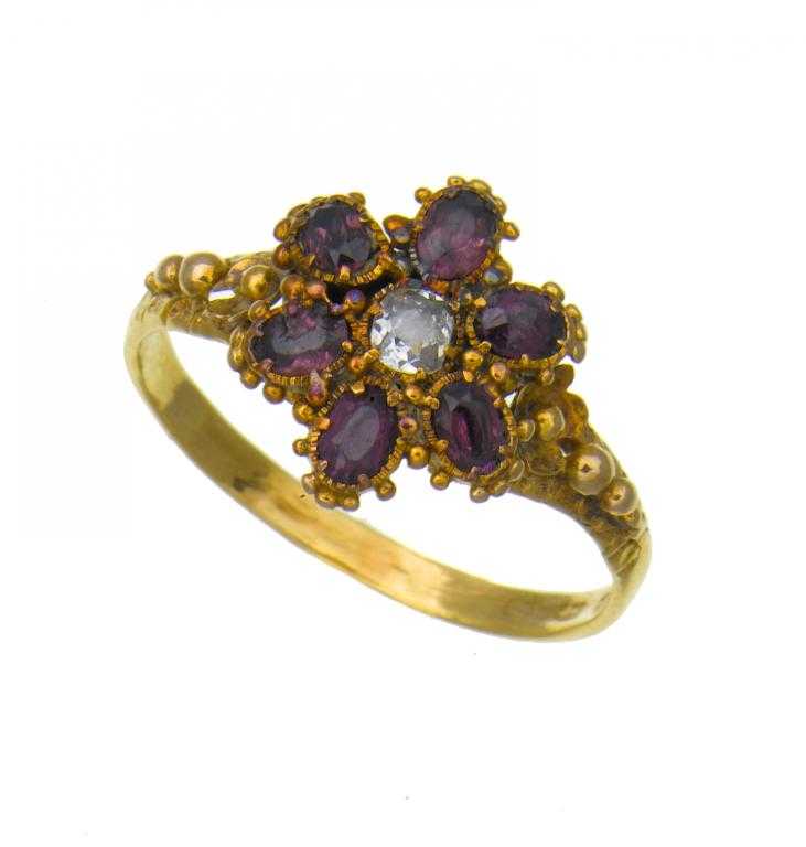 Appraisal: AN ANTIQUE ENGLISH DIAMOND AND AMETHYST MOURNING RING the flowerhead