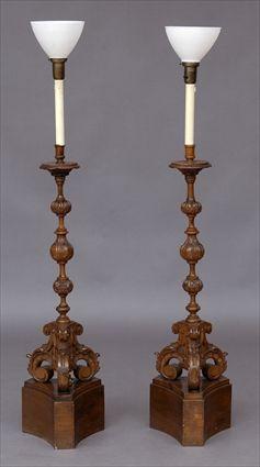 Appraisal: PAIR OF BAROQUE-STYLE CARVED PINE PRICKET STICK FLOOR LAMPS Each