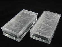 Appraisal: A pair of 's rectangular glass cigarette boxes the lids