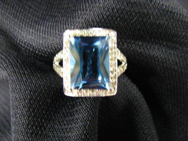 Appraisal: Blue Topaz Diamond Ring rich blue carat gem surrounded by