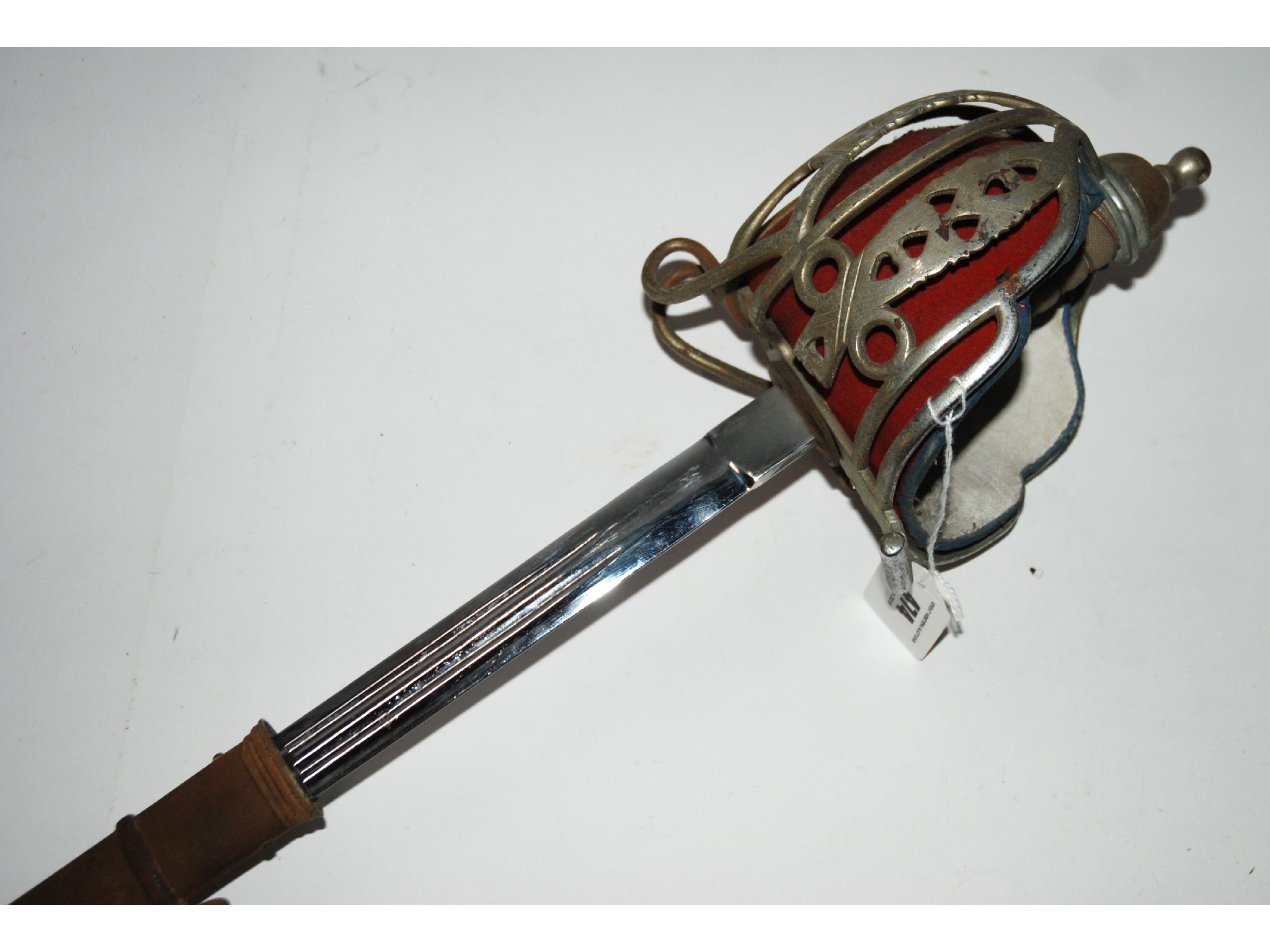 Appraisal: A basket hilt sword with chromed etched blade in steel