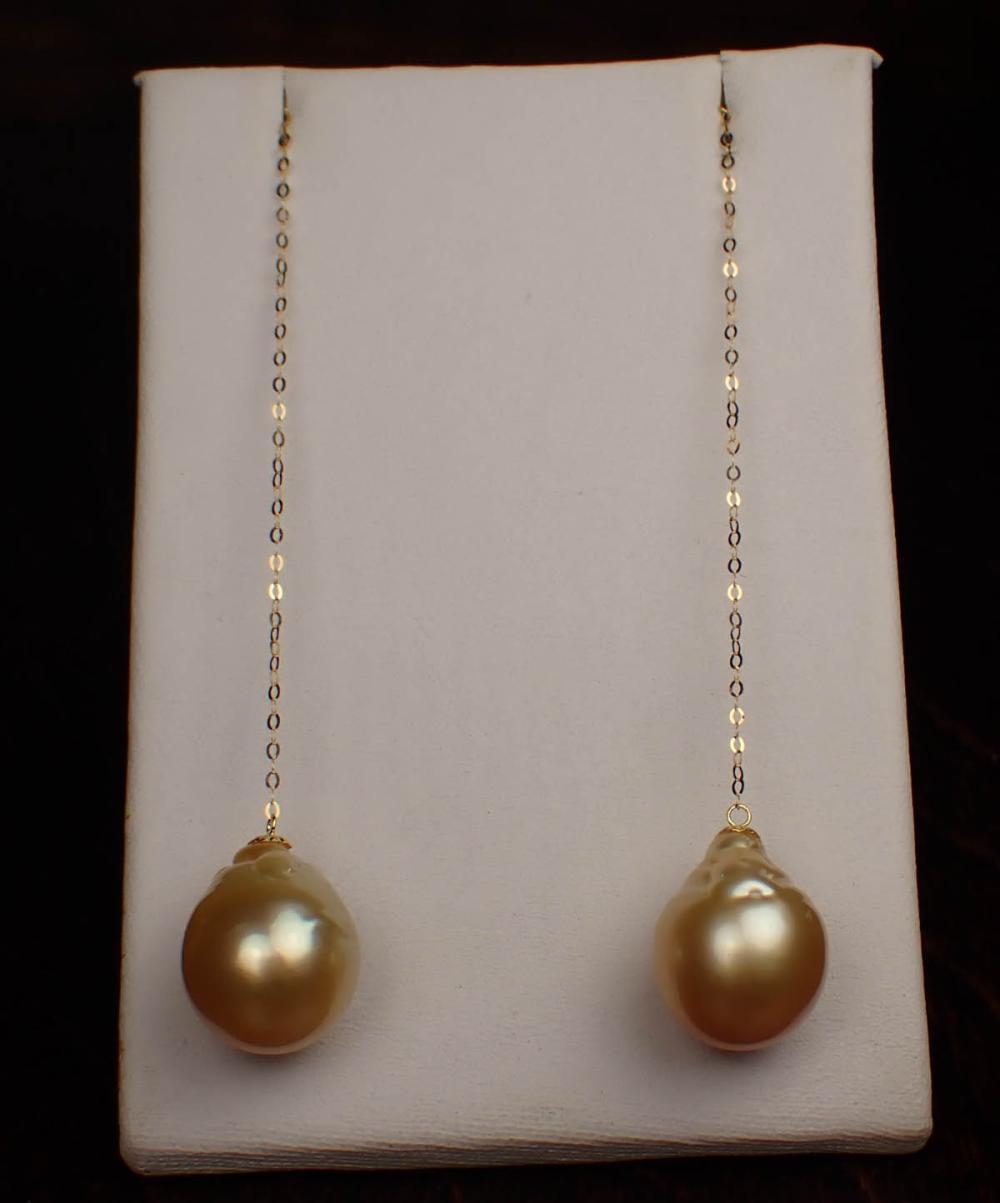 Appraisal: PAIR OF GOLDEN SOUTH SEA PEARL DROP EARRINGS each length