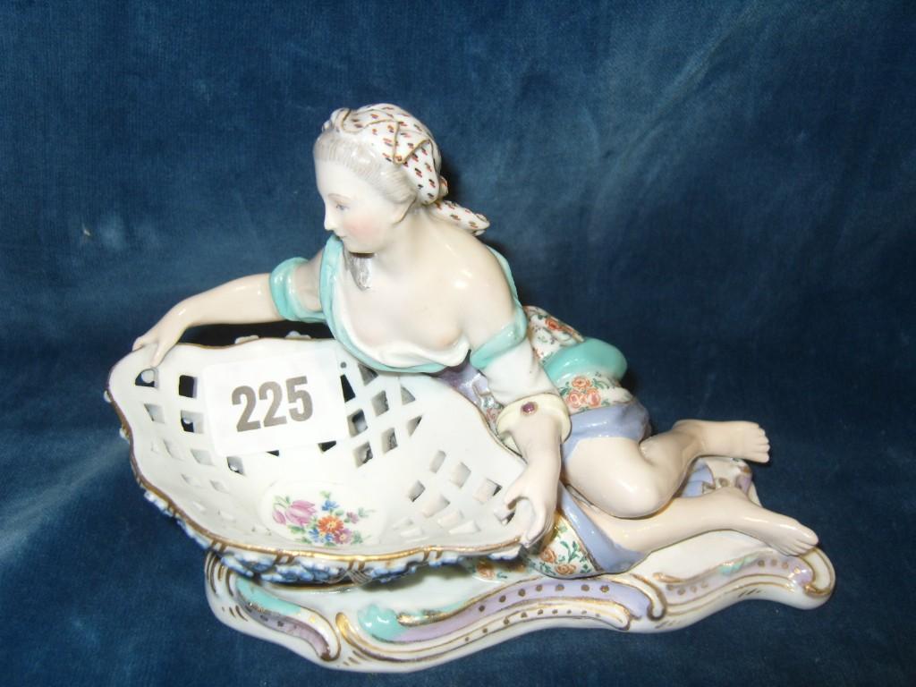 Appraisal: A th century Meissen figure of a recumbent female character