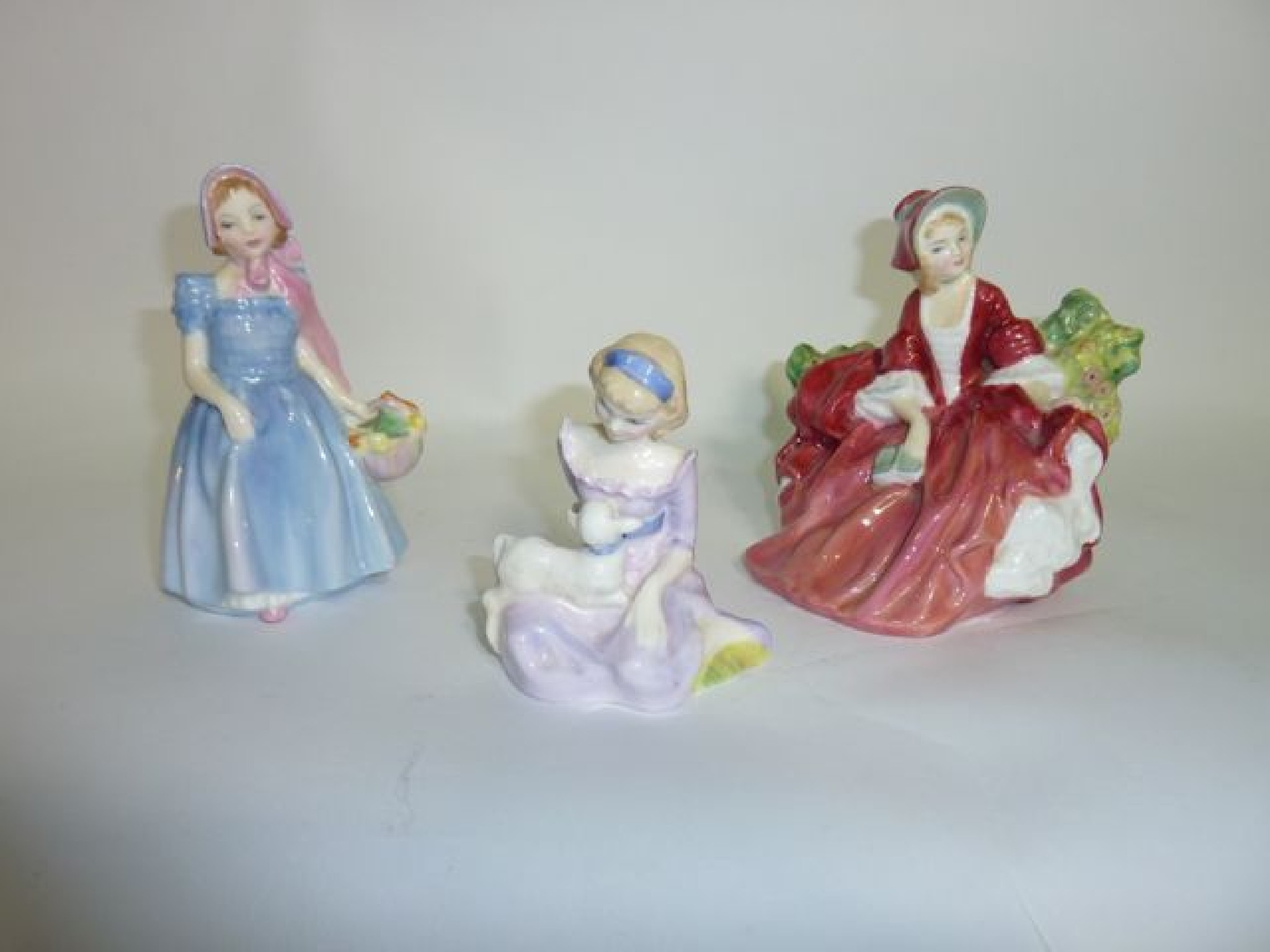 Appraisal: A collection of three Royal Doulton figures Wendy HN Mary