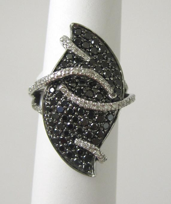 Appraisal: BLACK DIAMOND AND FOURTEEN KARAT WHITE GOLD RING set with