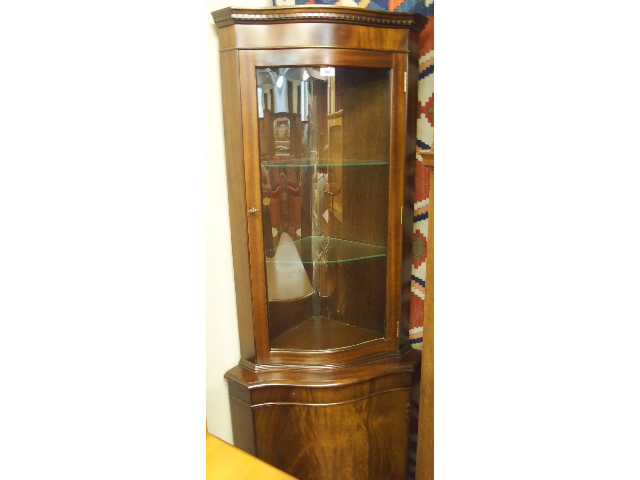 Appraisal: A contemporary mahogany display corner cabinet