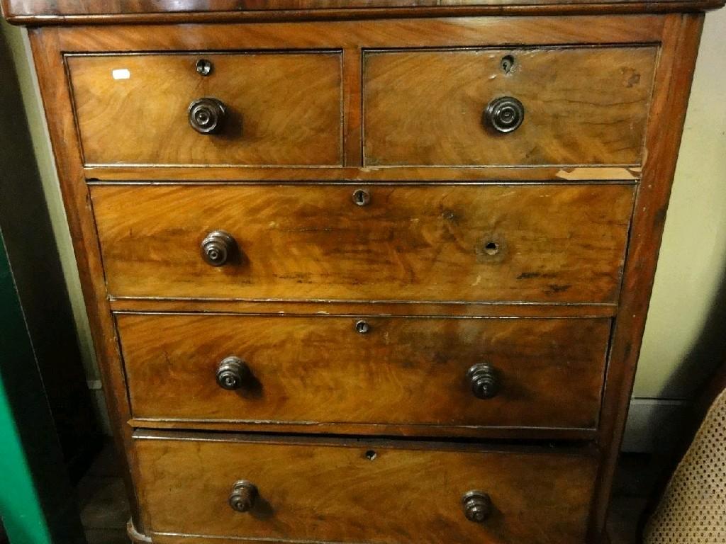 Appraisal: A Victorian mahogany chest fitted with three long and two