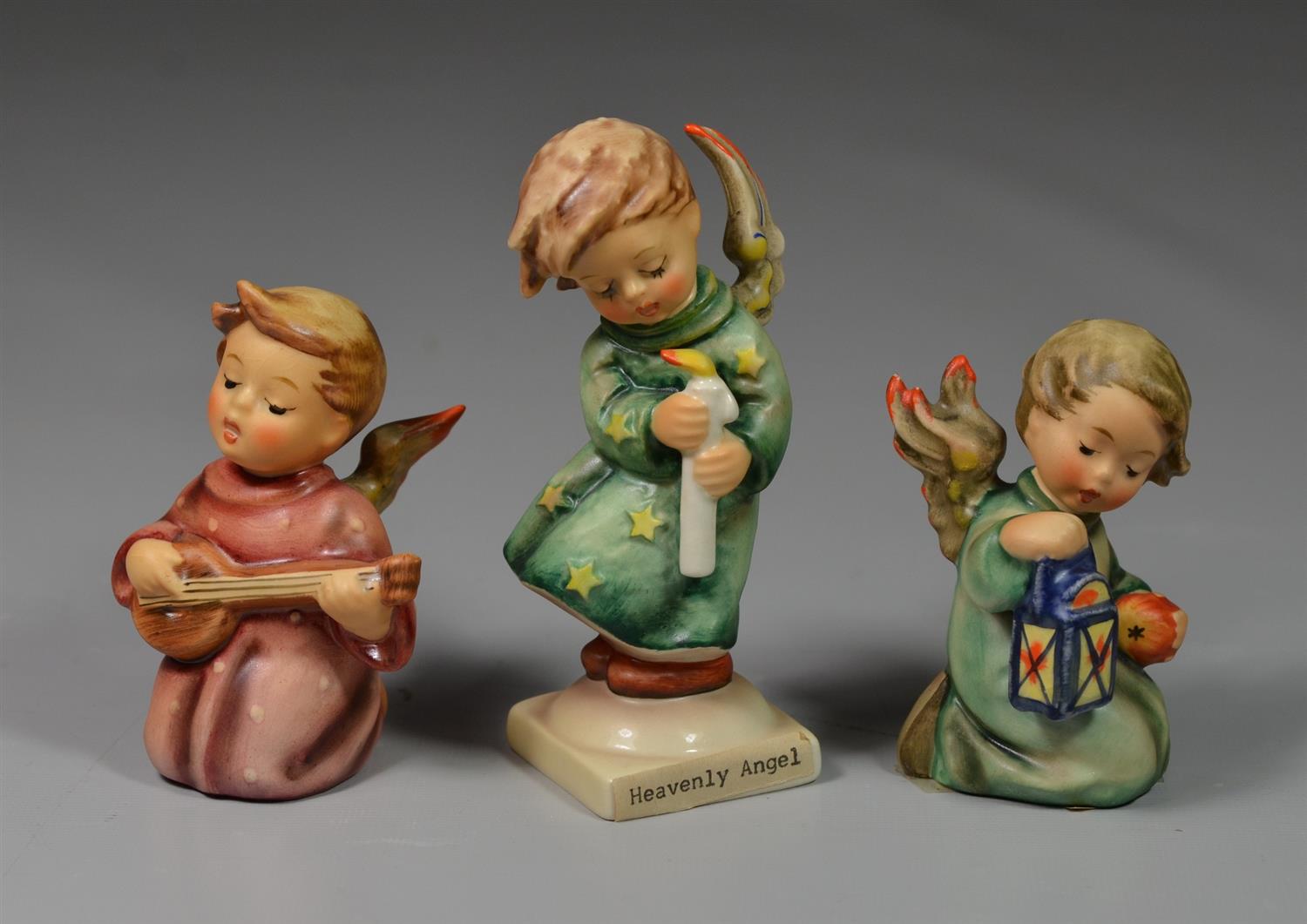 Appraisal: Goebel Hummel Figurines Angel Serenade D crazing Guiding Angel crazing