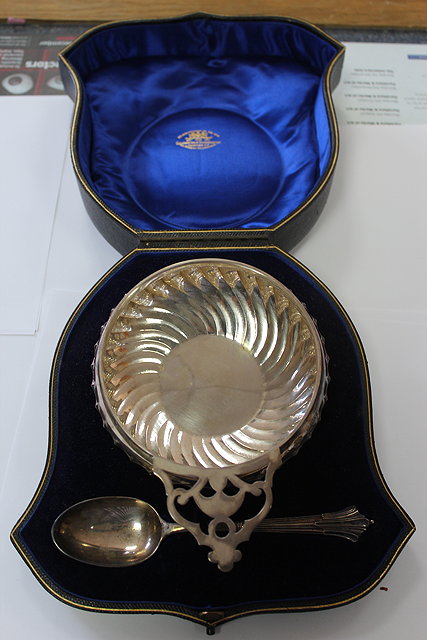 Appraisal: A GOLDSMITHS AND SILVERSMITHS CO PORRINGER AND SPOON in a