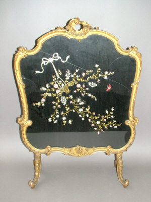 Appraisal: A late th century rococo style carved and giltwood firescreen