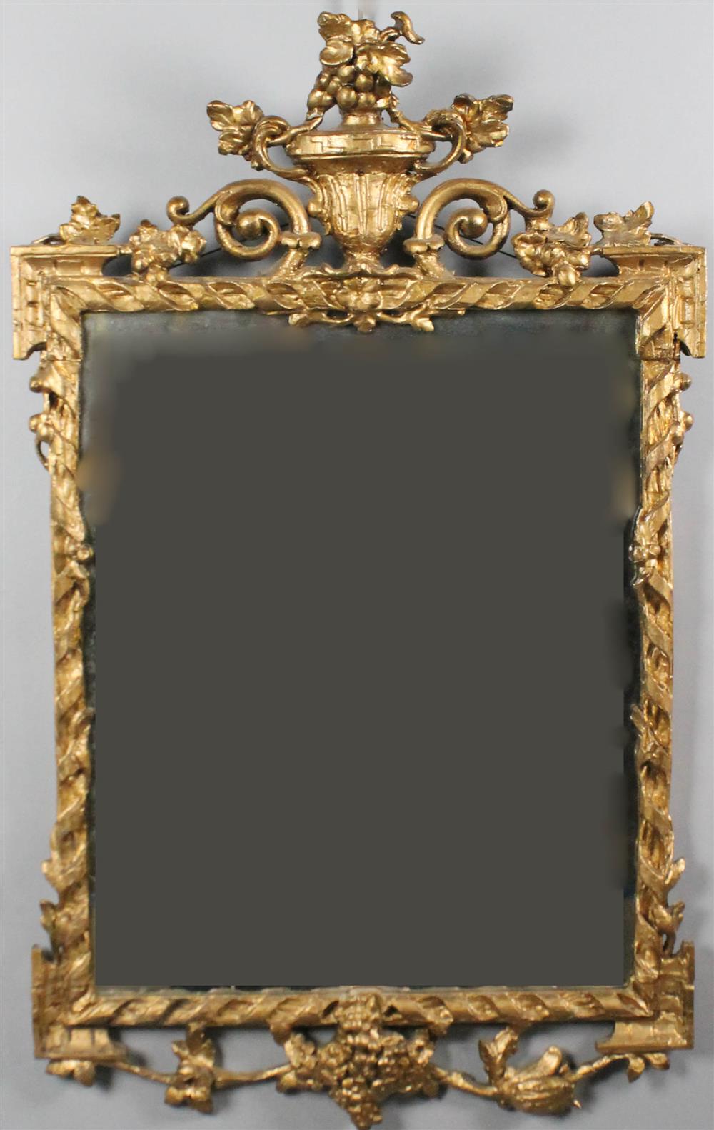 Appraisal: FRENCH TH C CARVED GILTWOOD MIRROR having a crest with