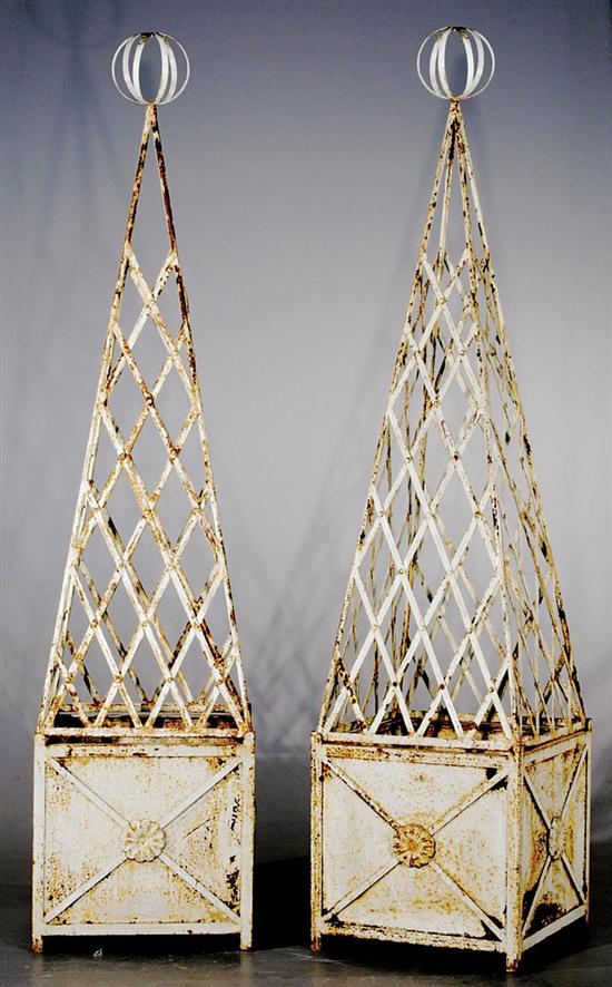 Appraisal: Pair painted cast-iron trellises with jardinieres latticework in obelisk form