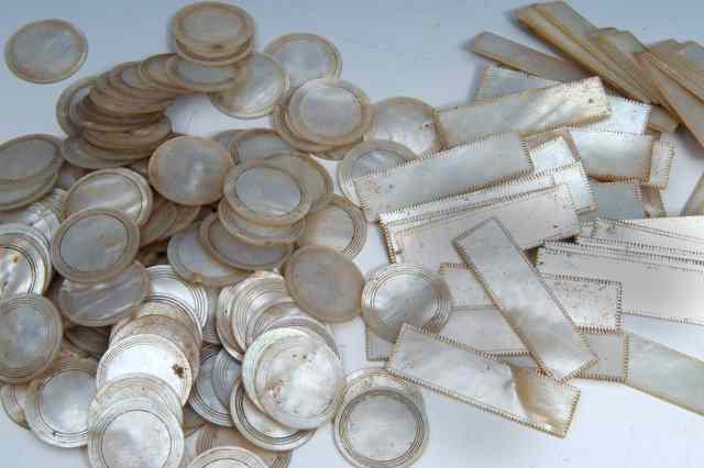 Appraisal: A QUANTITY OF MOTHER OF PEARL GAMING COUNTERS TO INCLUDE