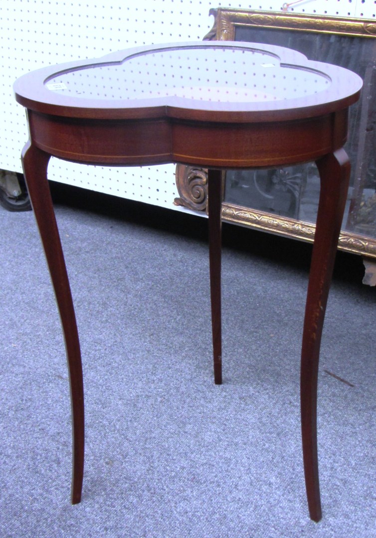 Appraisal: A th century inlaid mahogany trefoil shape vertu table on