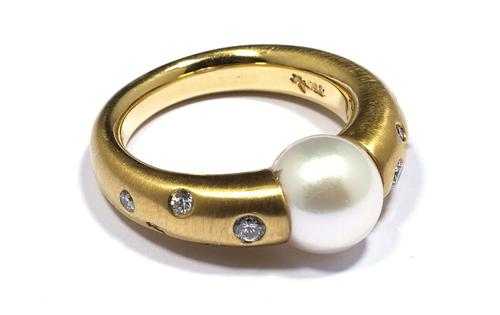 Appraisal: PEARL AND BRILLIANT-CUT DIAMOND RING Yellow gold Elegant tension ring