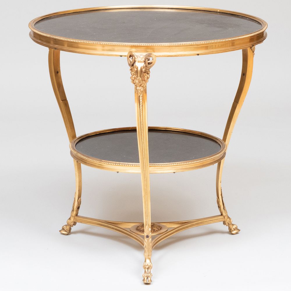 Appraisal: Louis XVI Style Gilt-Bronze Gu ridon Fitted with fossilized marble