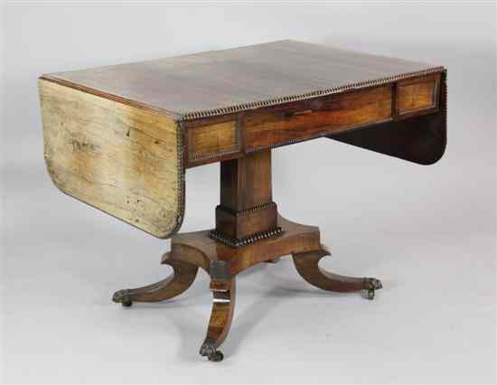 Appraisal: A Regency rosewood sofa table with drawer on a square