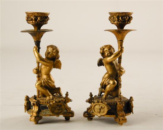 Appraisal: Pair Brass Cherub Candlesticks winged figure on pedestal base holding