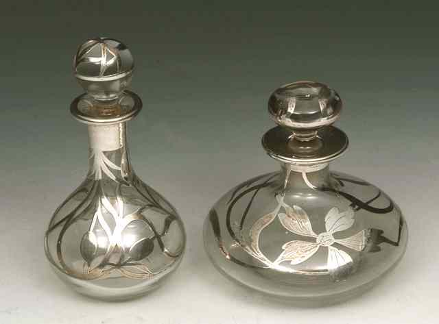 Appraisal: A SILVER AND GLASS OVERLAY PERFUME BOTTLE with leaf decoration