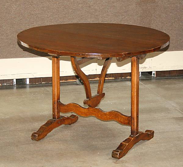 Appraisal: A Baroque style pine tilt top breakfast table mid th