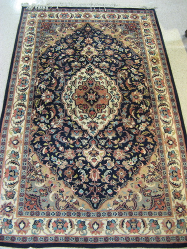 Appraisal: HAND KNOTTED ORIENTAL AREA RUG Indo-Persian floral and central floral