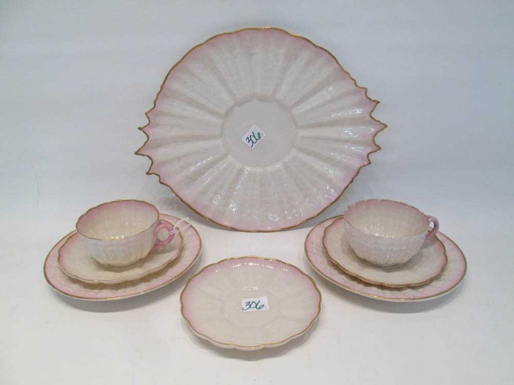 Appraisal: BELLEEK TRIDACNA TEA WARE SET eight pieces each with black