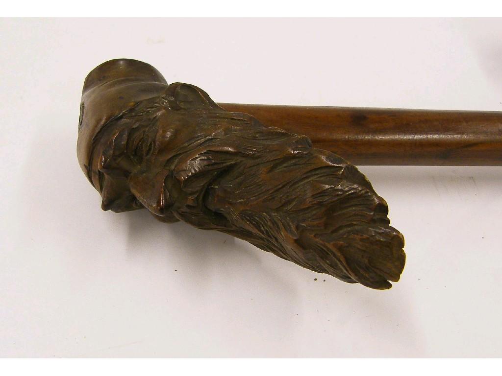 Appraisal: Walking cane the finial carved with the head of a