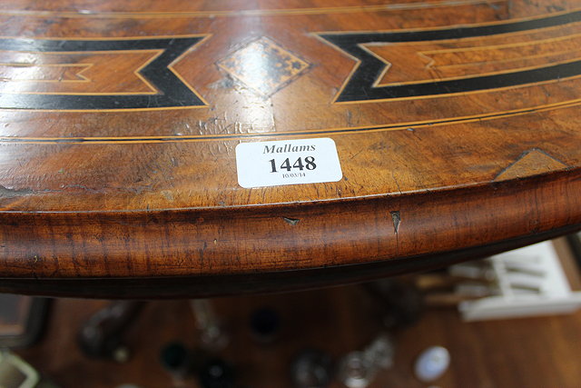 Appraisal: A VICTORIAN WALNUT AND INLAID OVAL LOO TABLE standing on