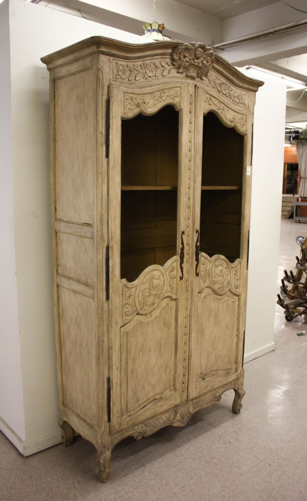 Appraisal: LOUIS XV STYLE ARMOIRE Continental early th century a carved