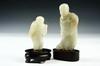 Appraisal: JADE CARVINGS - Lot of two carved jade oriental figures