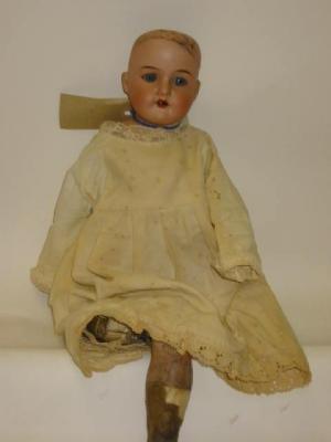 Appraisal: An Armand Marseille bisque shoulder head girl doll with blue